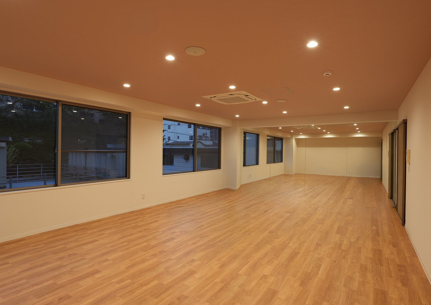 B.A.D. STUDIO: a multi-purpose room with a full mirror wall and sports flooring